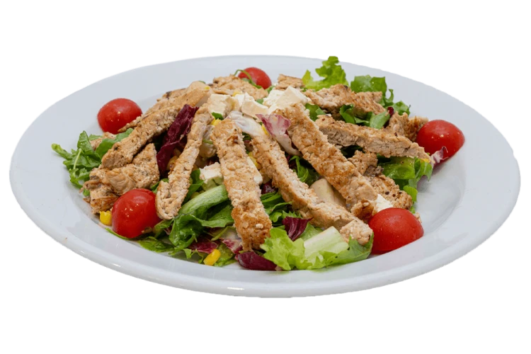 Rainbow salad with grilled and sliced turkey meat